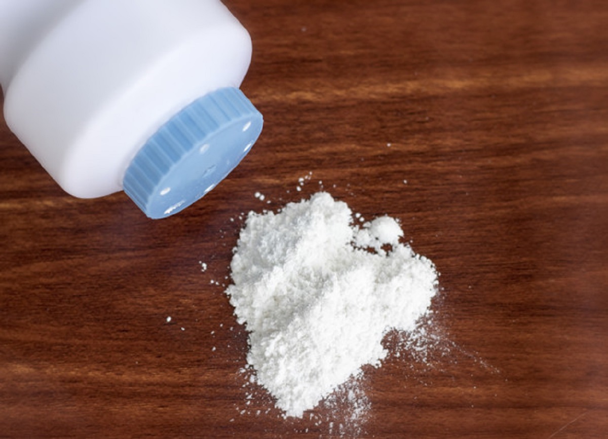 Baby powder on wood background, dangerous for health حلول ذكية